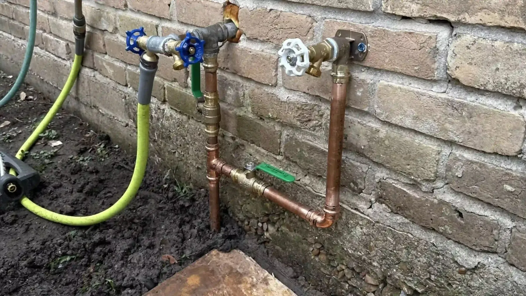 Copper and PVC pipework with shut-off valves—a real Byron Plumbing installation.