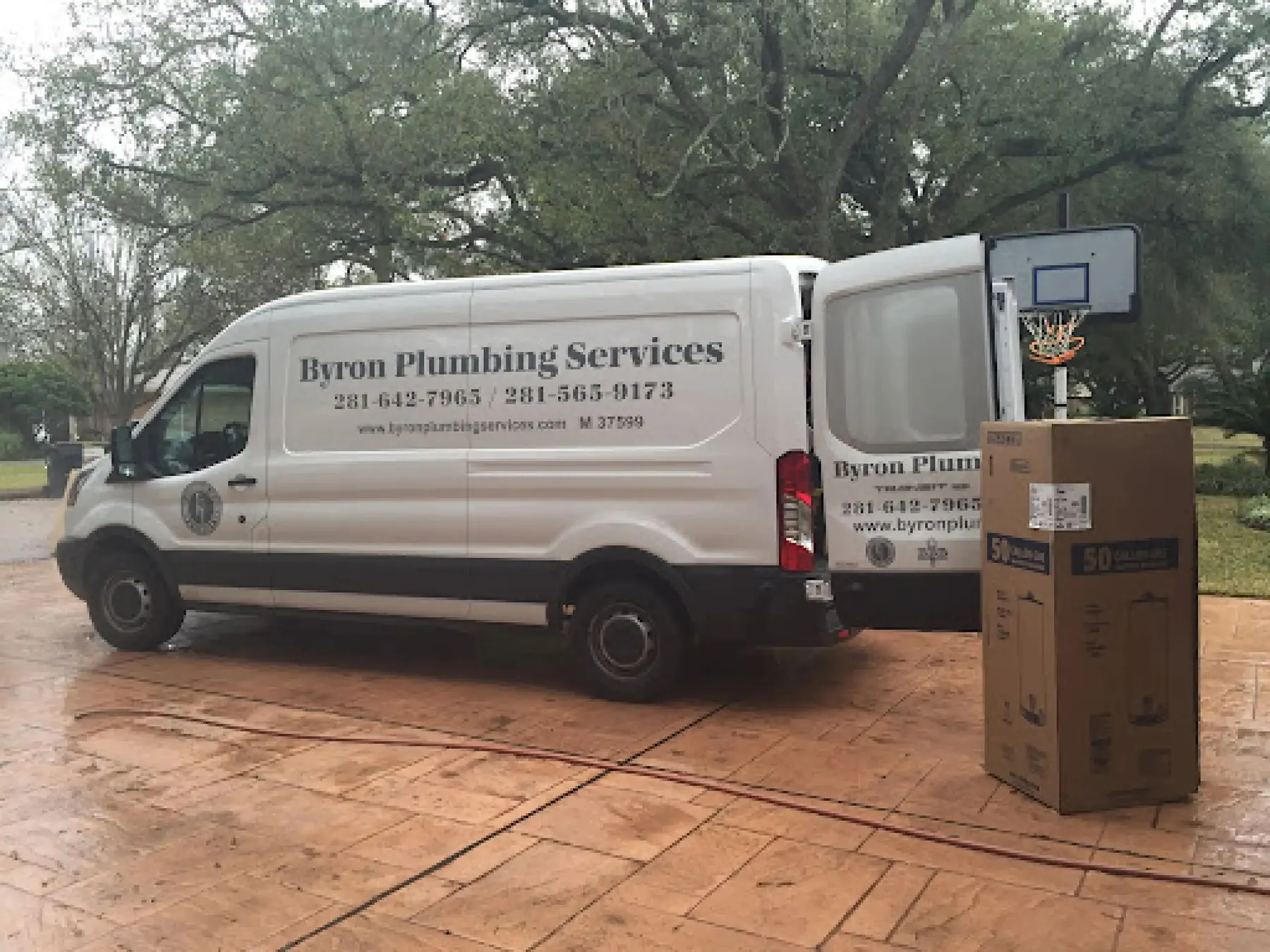 Byron Plumbing Services van parked at a residential property.