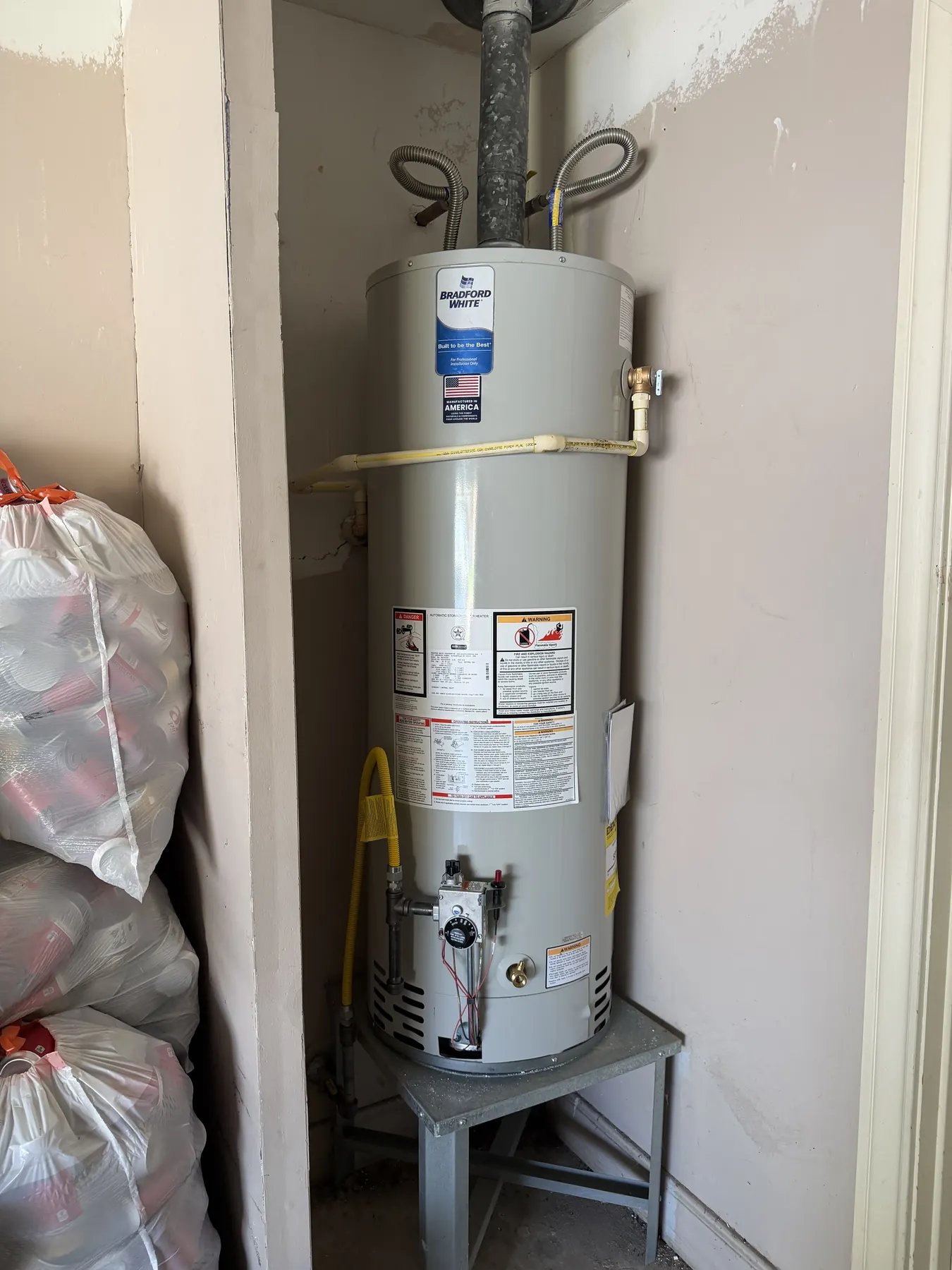 Old water heater assessed during a residential replacement project.