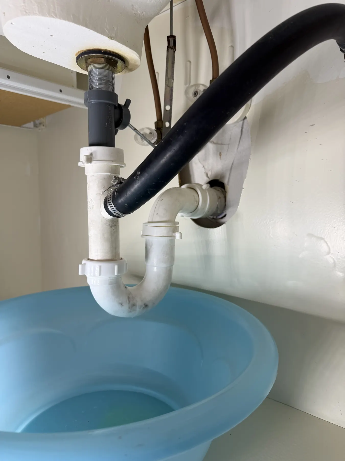 Sink P-trap and worn drain seals replaced to stop a leak.