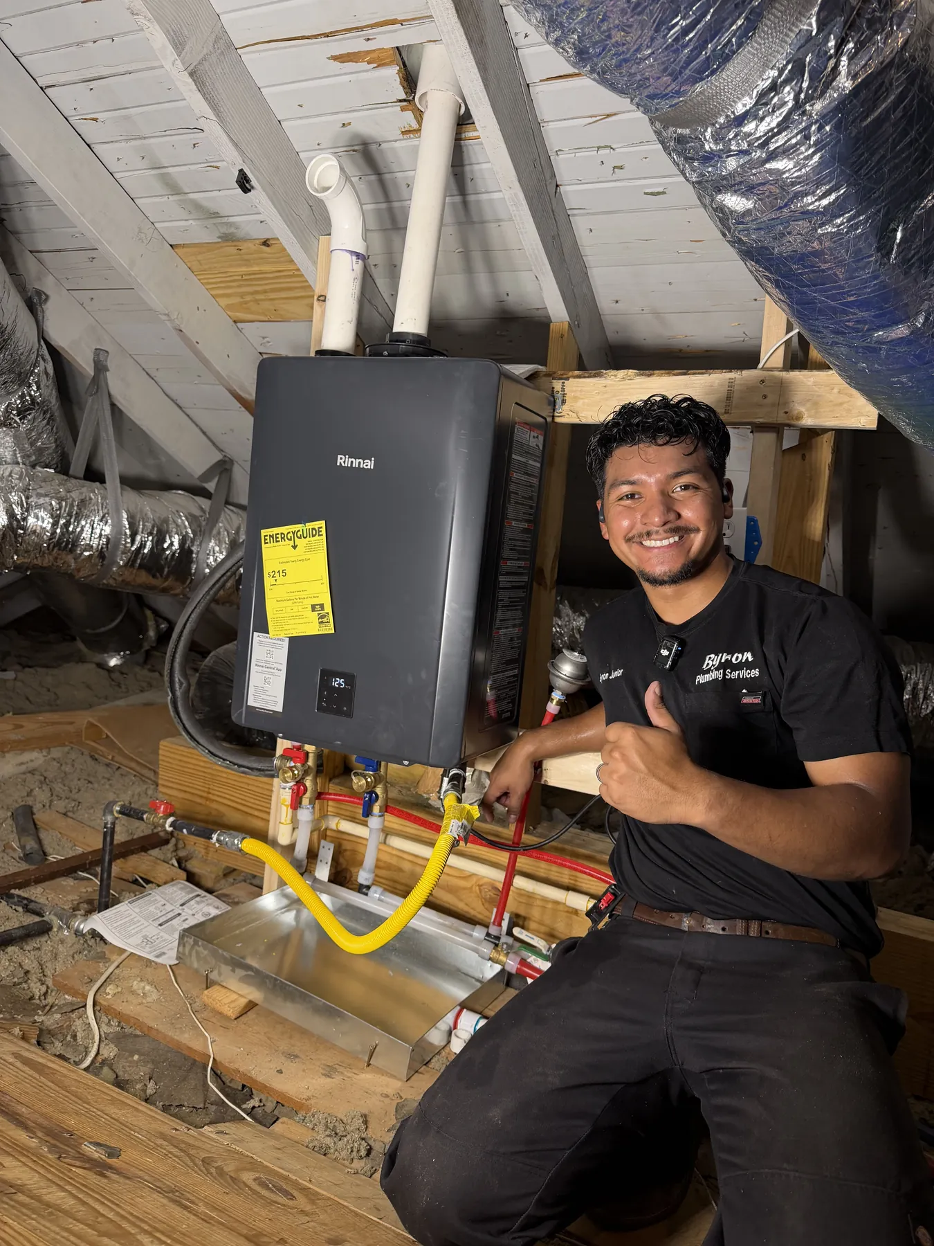 Tankless water heater conversion in an attic with new supporting connections.