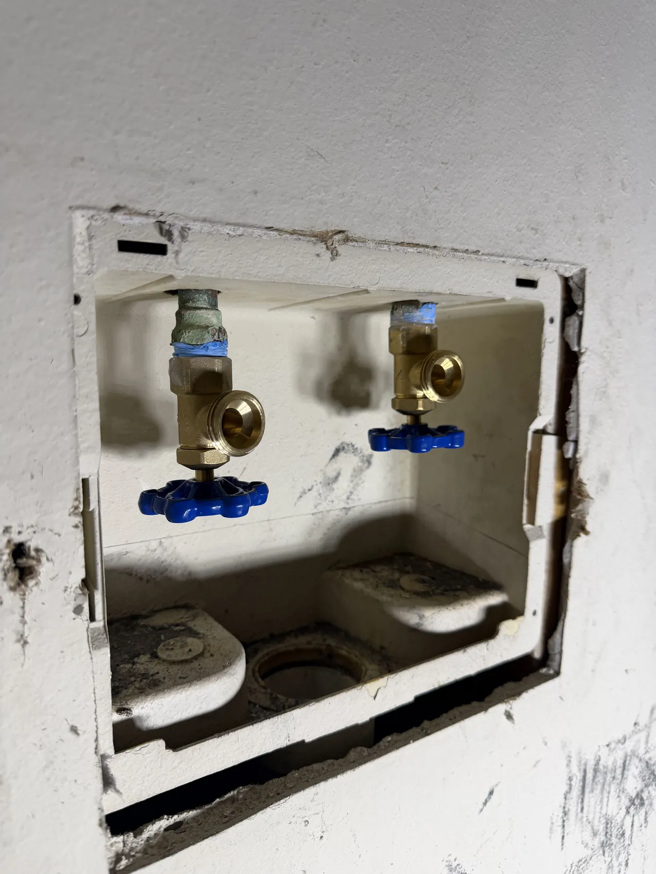 Corroded washing-machine shut-off valve replaced with new plumbing connections.